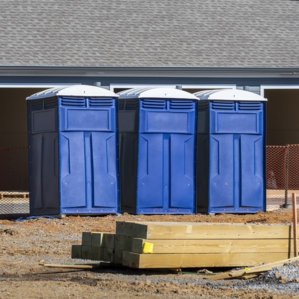 what is the cost difference between standard and deluxe portable restroom rentals in Chandler OK